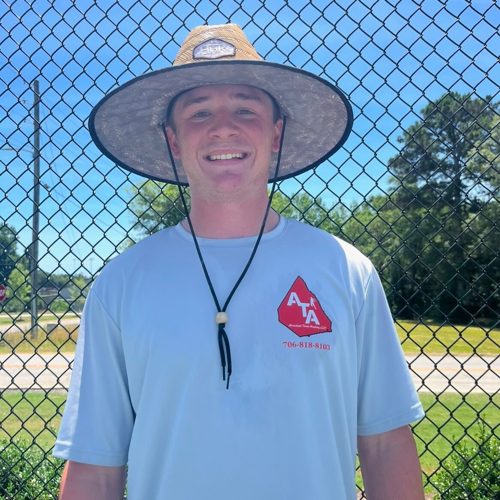 Coach Chandler Brady on court in an ATA shirt